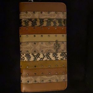 Brand new Coach snakeskin print wallet.